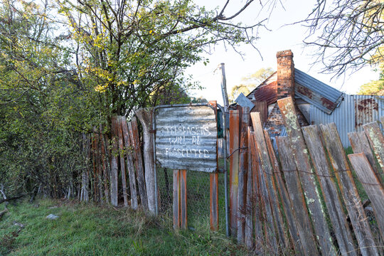Trespassers will be prosecuted sign on old shed