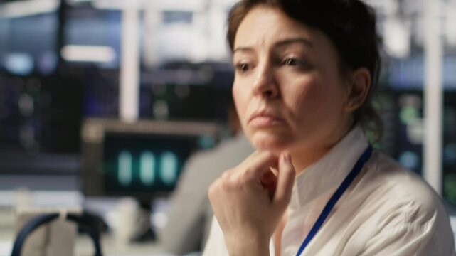 Software developer monitors server clusters performing AI training and inference tasks. IT expert supervising high tech computing systems managing machine learning storage operations, camera A closeup