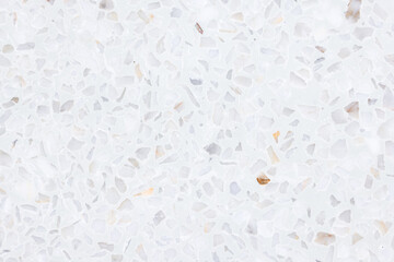 Terrazzo floor in top view. Seamless texture consistent throughout. New clean white bright and regularly. Small gray gravel mixed with mortar cement. Polished smooth for floor, wall or cladding.