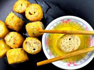 Deep fried chicken meat rolls in plate, in door Chiangmai Thailand.