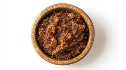 Brown sauce in a wooden bowl, top view