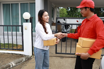 A woman receives a package at her doorstep from a delivery man. The moment captures online...