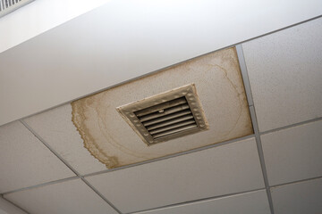 Water drop leak on air conditioner grille is ceiling stain and cracked and mold.