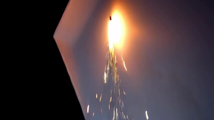 Dynamic sparks of light illuminate a dark backdrop, creating a vivid display of movement and vibrant energy, ideal for festive occasions and celebrations.