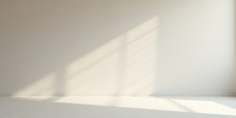 Fototapeta premium Empty Room with Sunlight Streaming Through Window, Illuminating a Simple Wall and Floor