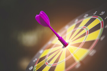 Bulls eye target goal or dartboard has dart arrow throw hitting center shooting for strategy...