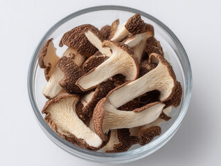 Dried shiitake mushroom slices in glass bowl ready for cooking or healthy meal preparation