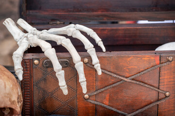 Skeleton covering a wooden box