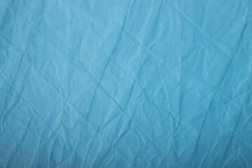 Abstract wrinkled blue crumpled paper texture background