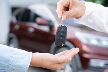 lease, rental car, sell, buy. Dealership manager send car keys to the new owner.  Sales, loan credit financial, rent vehicle, insurance,  renting, Seller, dealer, installment, car care business