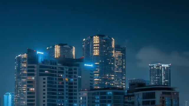 Modern illuminated cityscape of osaka at night with glowing skyscrapers and vibrant urban lights reflecting on wet streets