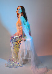 Fantasy studio portrait of a red-haired mermaid faery model wearing a white pearl gown, fairytale...