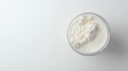 Creamy Greek Yogurt in Glass Bowl on White Background with Copy Space, Top View yogurt creamy white
