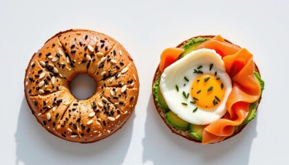 Close-up of a freshly baked sesame seed bagel and a colorful open-faced sandwich topped with a slice of cucumber, smoked salmon, and a sunny-side-up egg on white background