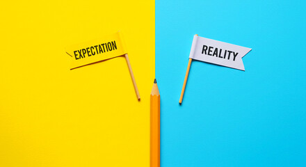 Expectation versus reality concept with flags and pencil on a split colored background design