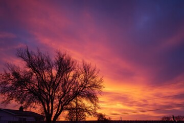 Obraz premium Vibrant sunrise sky over residential area