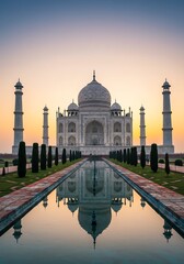 Naklejka premium Taj Mahal Sunset: Serene Reflection in Mughal Architecture