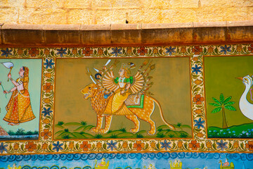 Colorful Indian mural painting outside on Mehrangarh Fort, Jodhpur, India. © CRSHELARE