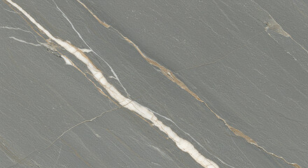 A close up of gray marble with white and brown veins running through it diagonally across the surface