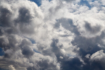 Dark cumulus clouds combined with sunlight symbolize the struggle of opposites: light and dark. Used in religious and philosophical themes.