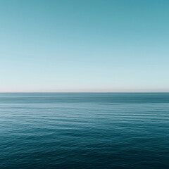 Obraz premium Vast expanse of tranquil blue water meets a distinct horizon line beneath a light clear sky, suitable for large format advertising or website banners.