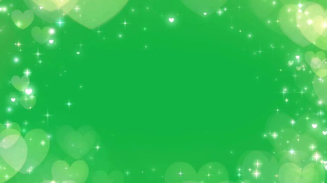 Glittering hearts stars light effects on green screen background.
