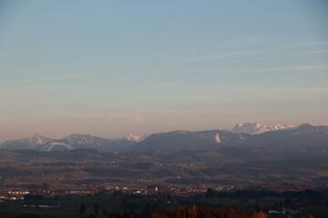 The sky is blue and the mountains are covered in snow