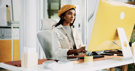 Creative, woman and typing on computer in office for campaign management, KPI tracking and client...