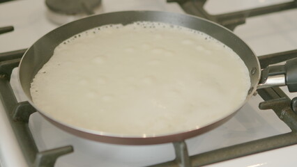 Cooking Pancakes on a Stove A Delicious Preparation for a Tasty Breakfast Meal
