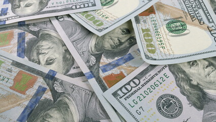 A visually striking display of Stacked Hundred Dollar Bills resting on a flat Surface