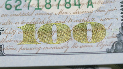 A CloseUp Macro Shot of a One Hundred Dollar Bill with Detailed Focus and Clarity