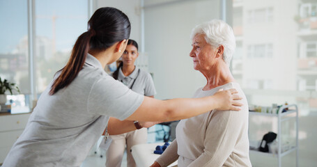 Fototapeta premium Physiotherapist, old patient and help with consultation, assessment or exam for diagnosis, medical and healthcare. Service, rehabilitation and women in physiotherapy with senior care for healing