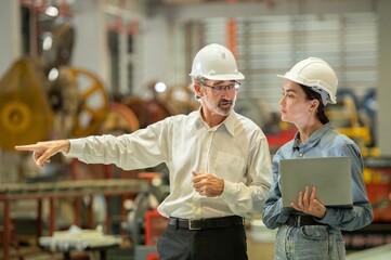 woman engineer assistant secretary in helmet inspection check control heavy machine construction...