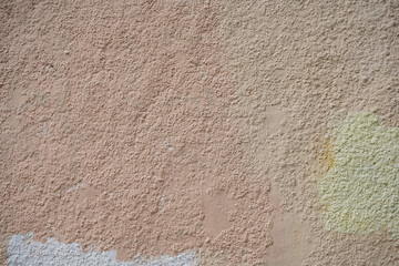 Rough wall with old paint stains.
