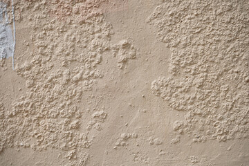 Rough wall with old paint stains.
