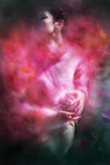 Woman Holds a Purple Dahlia Flower Under Her Transparent Top