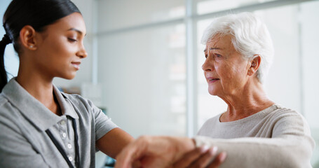 Physiotherapy, wrist pain and woman with senior patient for medical service, support and wellness. Healthcare, chiropractor and physical therapist with person for consulting, rehabilitation and help