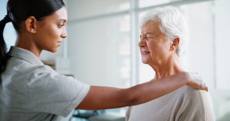 Obraz premium Physical therapy, shoulder pain and woman with mature patient for medical service, support and wellness. Healthcare, chiropractor and physiotherapist with person for consulting, recovery and help
