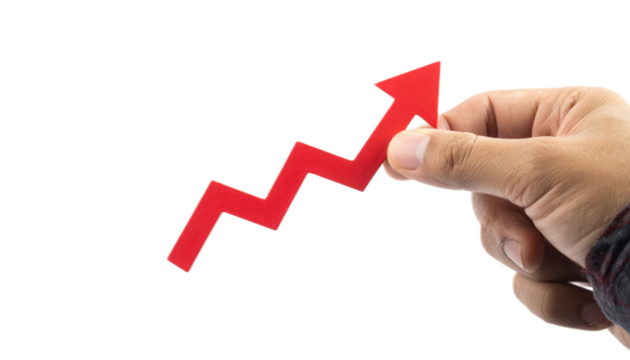 Hand Holding Red Arrow Signifying Growth and Progress in Business, Finance, and Personal Development