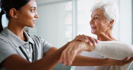 Physiotherapy, consulting and woman with senior patient for medical service, support and wellness. Healthcare, chiropractor and physical therapist with person for mobility, rehabilitation and help