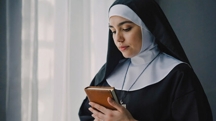 Nun Reading a Book by Window: A young nun, dressed in traditional black robes and white veil, stands by a window, thoughtfully reading a small, brown book.