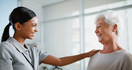 Obraz premium Support, doctor and smile with old woman in office for patient feedback, insurance and physiotherapy plan. Healthcare, rehabilitation and medical help with people in clinic for consulting and trust