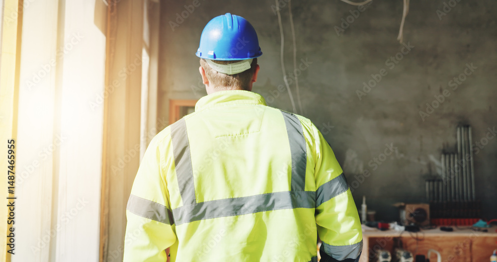 Poster construction, walking and man with back on site for building inspection, property development or qua