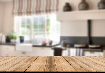 Empty wooden table and blurred kitchen background