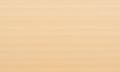 Smooth light wood surface background with subtle grain patterns.