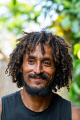 
Close-up portrait of a smiling local man with dreadlocks, enjoying the caribbean lifestyle in...