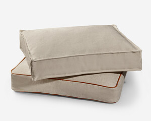 Comfortable washable dog bed with removable cushion cover resting on another one