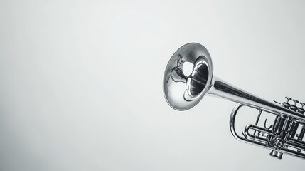 Silver Trumpet Isolated Against Soft White Backdrop Demonstrating Musical Instrument