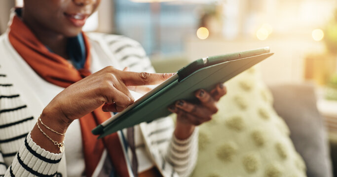 Woman, hands or tablet in home to search for online blog, interior design and social media post. Digital app, living room or female person on touchscreen technology for house renovation tips on couch