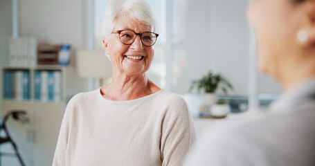 Physiotherapy, smile and senior woman in office, conversation and help with feedback. Professional,...